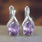 silver tone purple cz infinity earrings